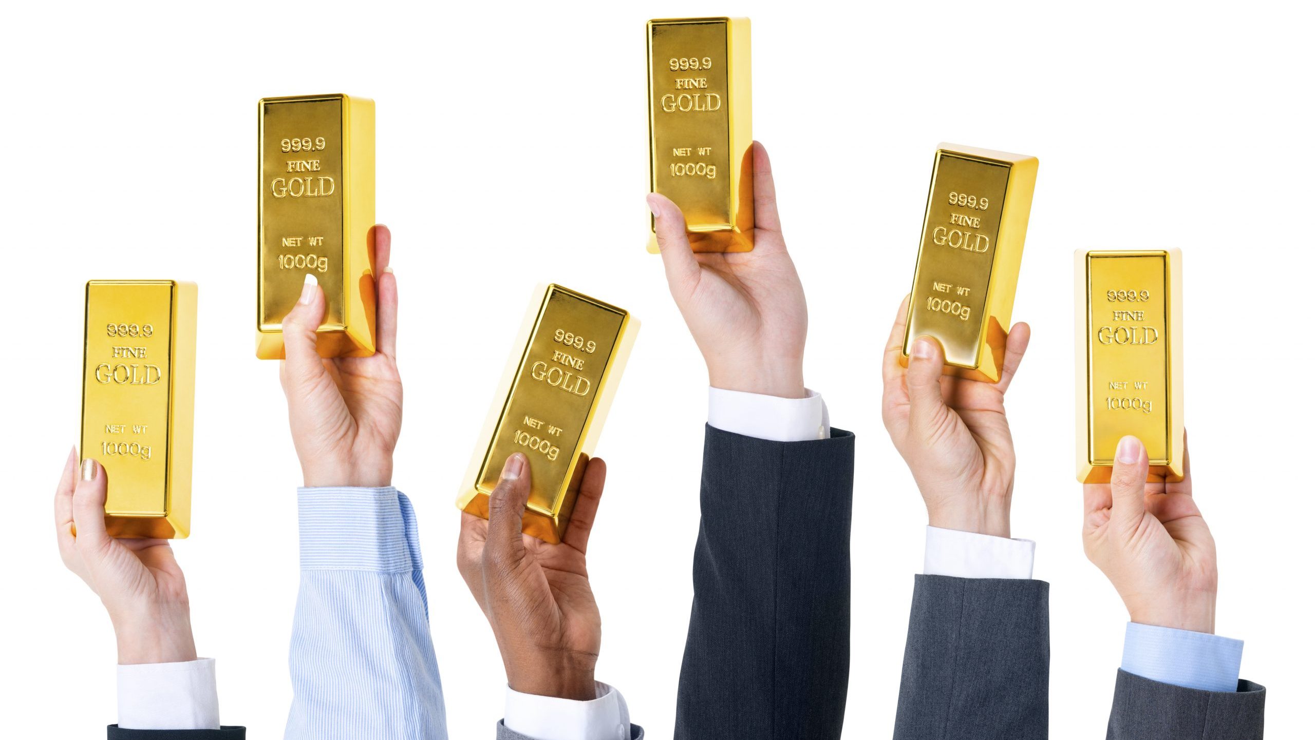 Hands holding gold bars.